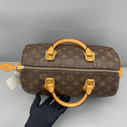 Sac à main d'occasion en cuir Louis Vuitton Speedy - bon état - Chakmar Luxe