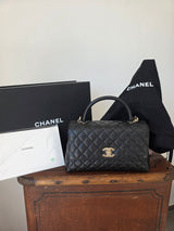 Chanel Handle Handle Handle Bag in black quilted grained leather